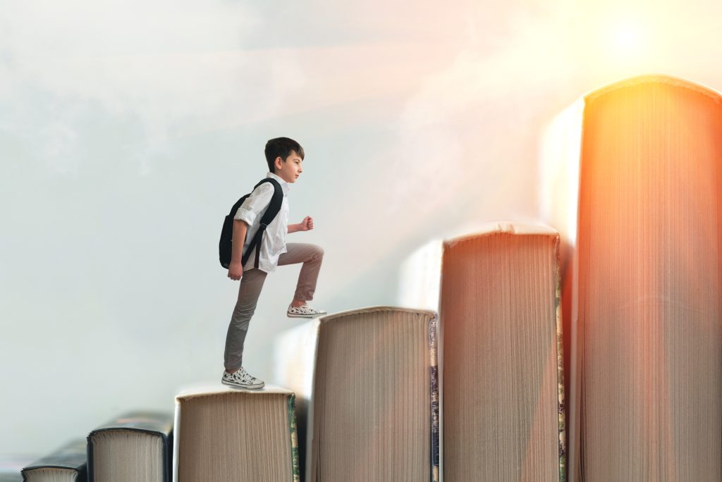 Child,Climbing,Stairs,Made,Of,On,Sky,Background.,Education,Or