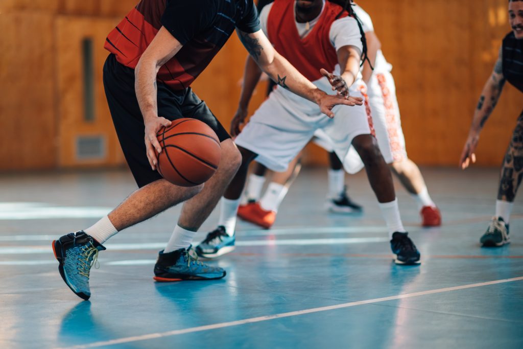 Cropped,Picture,Of,Professional,Multicultural,Basketball,Players,Practicing,Basketball,On